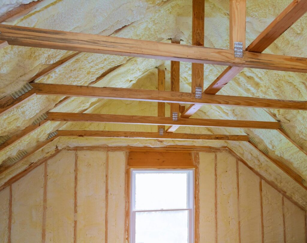 Blown in insulation in Ball Ground, GA being applied in a residential attic