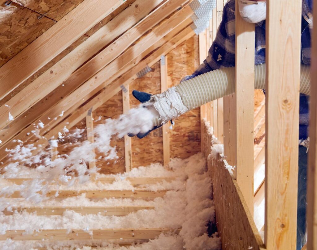Blown in insulation in Waleska, GA being installed in a residential attic