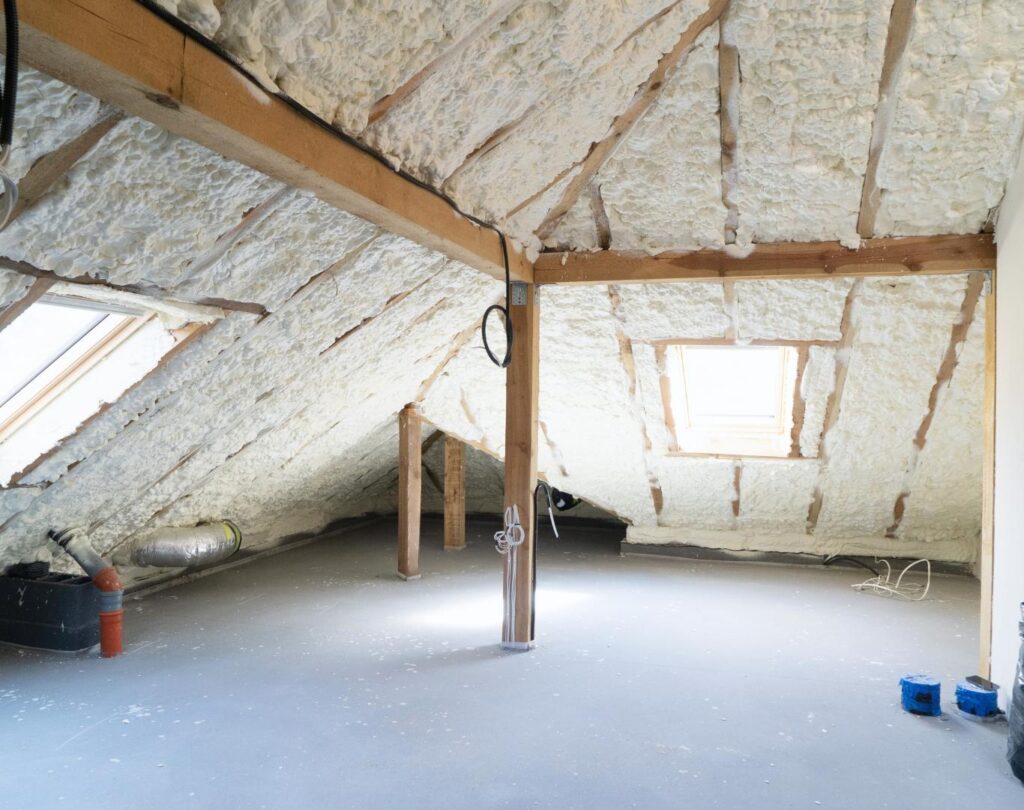 Blown in insulation in Cohutta, GA being installed in a residential attic