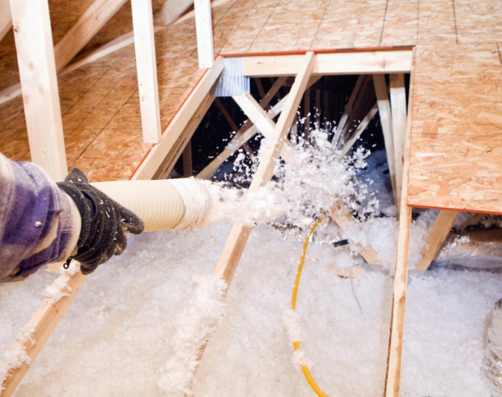 Blown in insulation in Varnell, GA being installed in a residential attic
