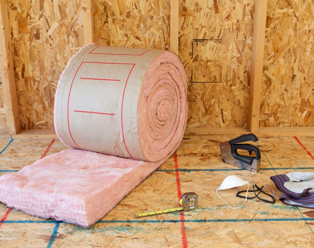 Fiberglass insulation in Blue Ridge, GA being installed in a residential attic