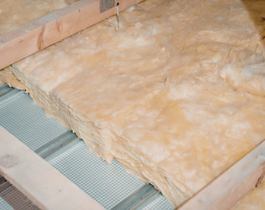 Fiberglass insulation in Mineral Bluff, GA being installed in a residential attic